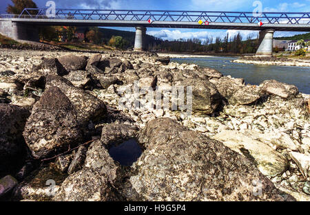 Dry riverbed Vltava River (Moldau) under a bridge in Kamyk Nad Vltavou, Czech Republic Lack of water Drought Europe Climate Change Impact Stock Photo