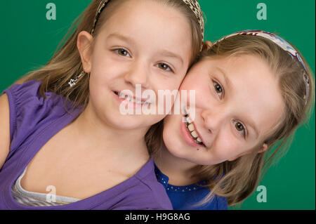 Portrait of two blonde girls, 6 and 8 years old Stock Photo