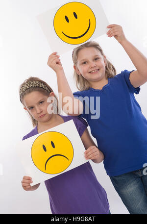 Sad and happy child, symbolic picture Stock Photo