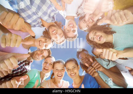 Composite image of low angle view of friends together Stock Photo
