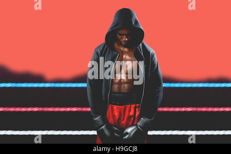 Composite image of boxer posing after failure Stock Photo