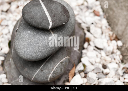 pebbles stacked up outdoors, natural stone Stock Photo