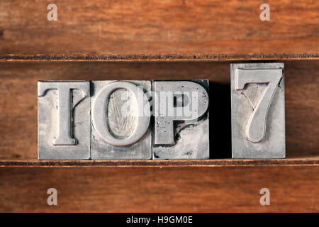 top 7 phrase made from metallic letterpress type on wooden tray Stock Photo