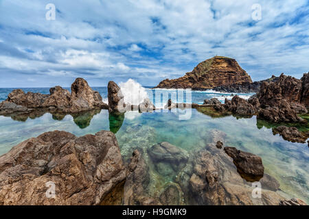 Lava rocks natural volcanic pools in Porto Moniz, Madeira, Portugal. Stock Photo