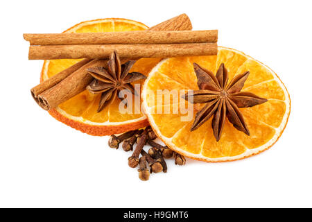 Dried orange slices with cloves and cinnamon sticks. Traditional Christmas spices isolated on white. Stock Photo