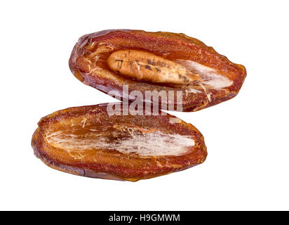 dried dates half two halves on white Stock Photo