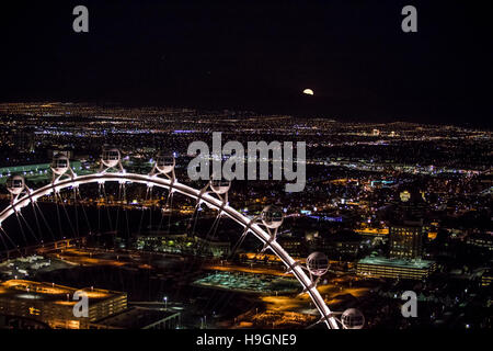 Super moon rising over an aerial view of Las Vegas city at night, Nevada, USA Stock Photo