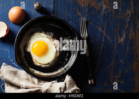 Fried eggs in a cast iron skillet Stock Photo