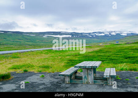 Picnic table and landscape near the Isafjordur fjord, in the west fjords region, Iceland Stock Photo