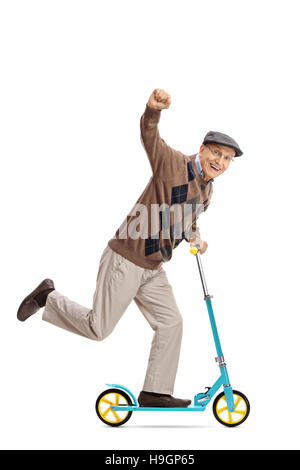 Full length portrait of an ecstatic senior riding a scooter and gesturing with his hand isolated on white background Stock Photo