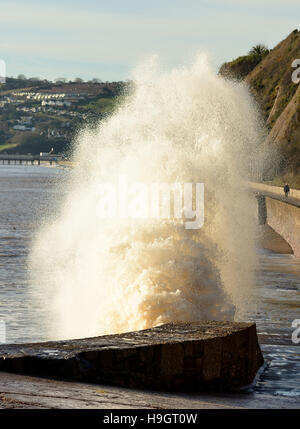 Rough seas during high tide along the Teignmouth sea wall. Stock Photo