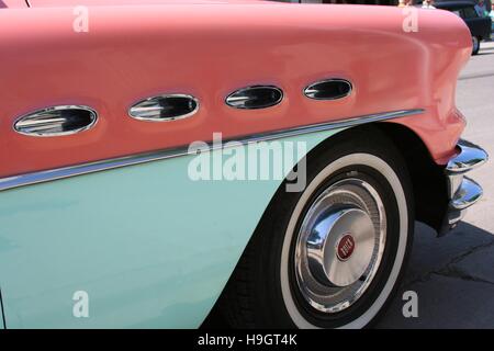 Automotive detail of a fender on a 1956 coral pink and aqua green Buick Century Hardtop Stock Photo