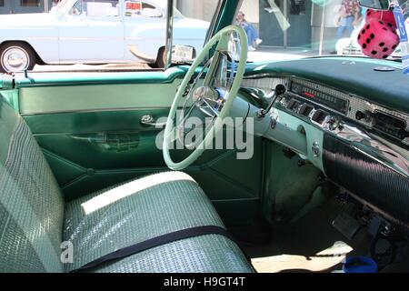 Front seat, steering wheel, and dashboard of a 1956 Buick Century Hardtop Stock Photo