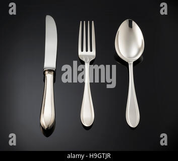 beautiful silver cutlery on black background. Stock Photo