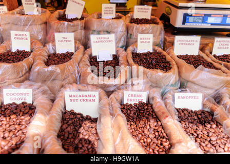 Flavoured coffee beans on sale at a market stall. Stock Photo