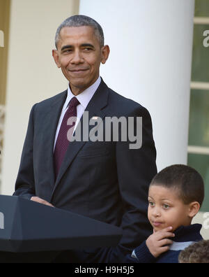 Washington DC, USA. 23rd November, 2016. United States President Barack Obama, left, joined by nephew Austin Robinson, 6, makes remarks as he pardons the 2016 National Thanksgiving Turkey, Tater, and its alternate Tot, during a ceremony in the Rose Garden of the White House in Washington, DC. This is the 69th anniversary of this honored tradition began in 1947 by President Harry S Truman. Credit:  MediaPunch Inc/Alamy Live News Stock Photo