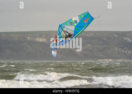 Weymouth, Dorset, UK.  24th November 2016.  UK Weather.  A windsurfer taking advantage of the strong winds and choppy seas off Weymouth Beach in Dorset to do a somersault in the air.  Photo by Graham Hunt/Alamy Live News Stock Photo