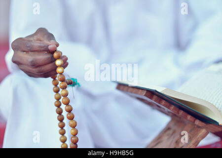 African Muslim Man Praying To God Stock Photo
