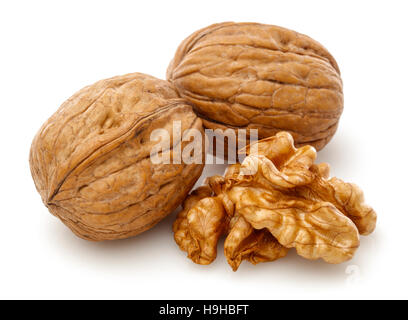 Peeled walnut kernel and whole walnut. Isolated on a white background Stock Photo