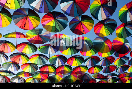 Multi-colored umbrellas in the sky.Umbrellas rainbow colors Stock Photo