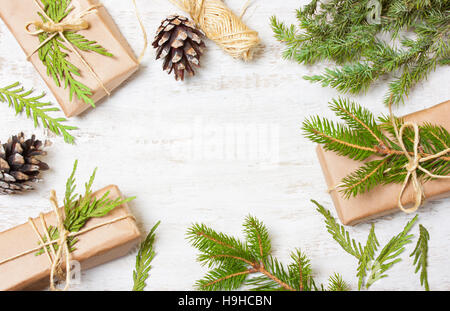 Decoration of the tree branches, cones, gifts on wooden background Stock Photo