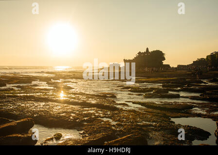 Tanah Lot temple and sea waves in beautiful sunset light, Bali, Indonesia Stock Photo