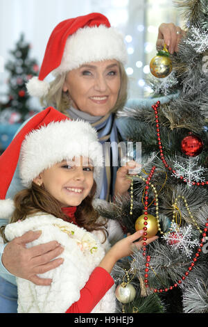 Decorating Christmas tree Stock Photo