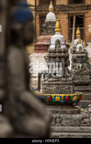 Buddha statue on the square near Swayambhunath stupa in Kathmandu valley, Nepal Stock Photo