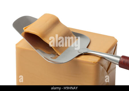 Piece of norwegian flotemysost cheese close up and a slicer Stock Photo