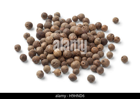 Heap of whole allspice berries on white background Stock Photo