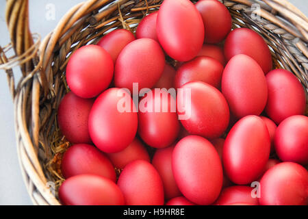 Traditional Greek Orthodox Red Dyed Easter Eggs in a Basket Stock Photo