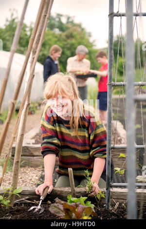A volunteer at the Golden Hill Community Garden in Bristol UK Stock Photo