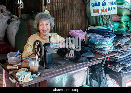 seamstress on a local market in Vinh Long, Mekong Delta, Vietnam, Asia Stock Photo