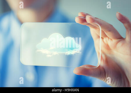 close up of woman with transparent smartphone Stock Photo