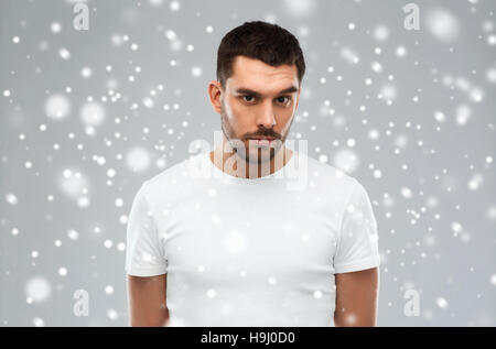 young man portrait over snow Stock Photo
