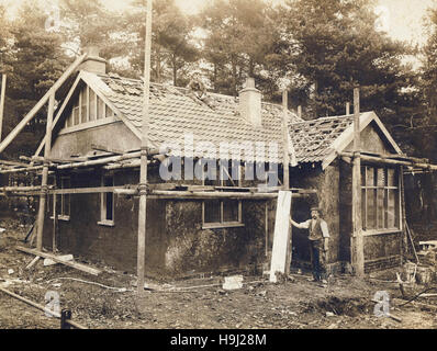 Historic archive image of two men working on the construction of a bungalow at Ascot. Berkshire Stock Photo