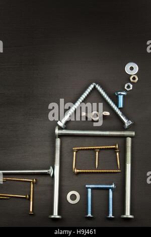 Plans to build a house. Rustic wooden background. Tools for builders. Architect designing a house for a young family. Stock Photo