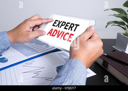 Expert Advice concept, man using tablet computer Stock Photo