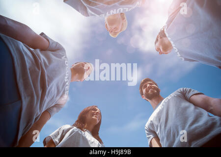 Composite image of low angle view of friends together Stock Photo