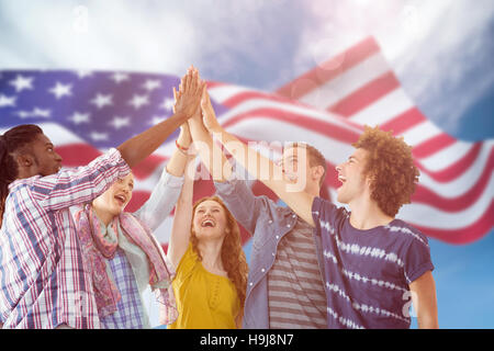 Composite image of fashion students putting hands together Stock Photo