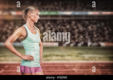 Composite image of profile view of sportswoman standing on a white background Stock Photo