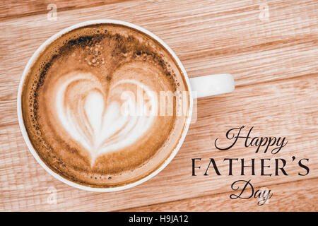 Happy fathers day message next to coffee Stock Photo