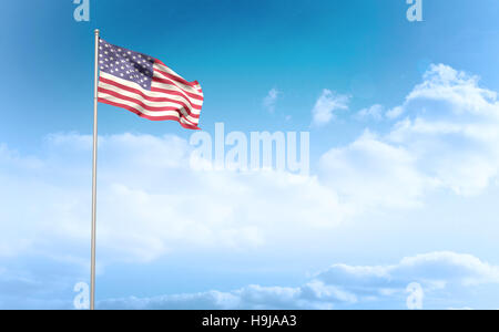 Composite image of american flag waving on pole Stock Photo