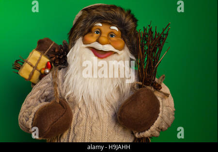 Santa Claus upper body close up with green background. Stock Photo