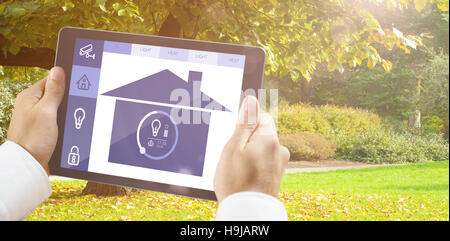Composite image of man using tablet pc Stock Photo