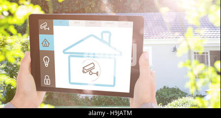 Composite image of cropped hand of man holding digital tablet Stock Photo