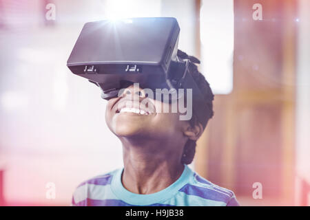 School boy in virtual reality glasses in classroom Stock Photo