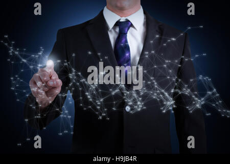 Composite image of businessman standing and pointing Stock Photo