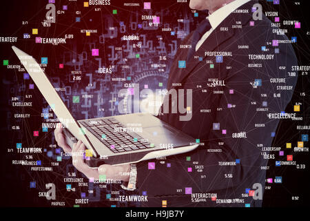 Composite image of businessman with watch using tablet pc Stock Photo