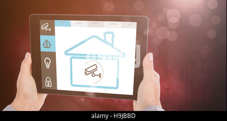 Composite image of cropped hand of man holding digital tablet Stock Photo